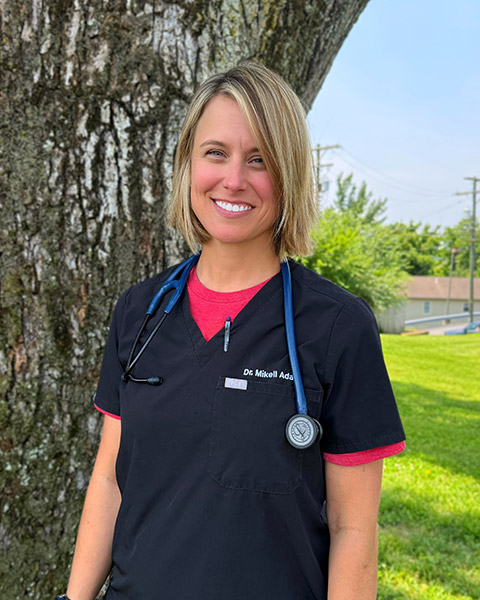vet standing outside and smiling