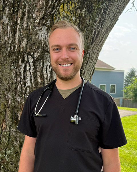 vet standing outside and smiling