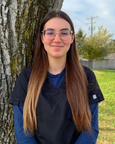 vet standing outside and smiling